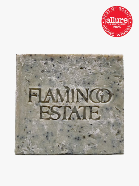 Flamingo Estate Exfoliating Peppermint Soap Brick in branded component with best of beauty seal in the top right corner on a light gray background