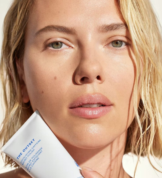 Close up of Scarlett Johansson hold bottle from The Outset