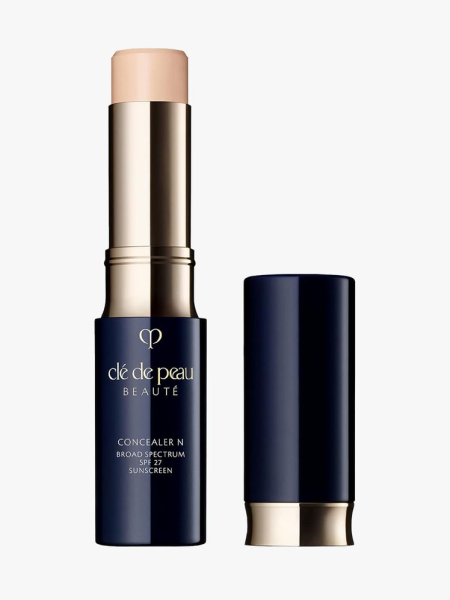 Clé de Peau Beauté The Concealer in branded component on a light gray background