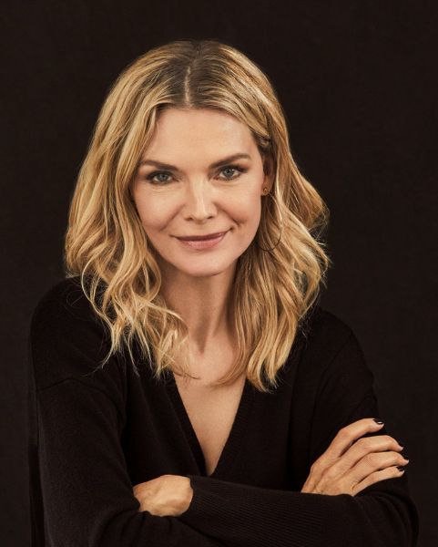 Michelle Pfeiffer posing in a black sweater